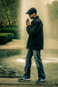 Bryan Grant posing on a fountain in Central Park, NYC.