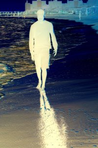 Ronell Cohill walking along the Coney Island Beach.