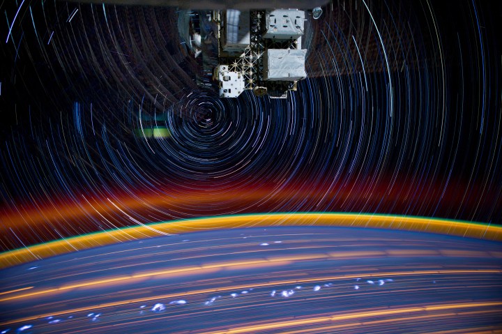 A Long shutter speed photo of stars and the Earth taken from the International Space Station. The round orb on the bottom is Earth. This photo was taken over time as the space station orbited our planet. Photo credit to NASA_JSC_Photo on Flickr.com